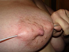Pricking of own breasts